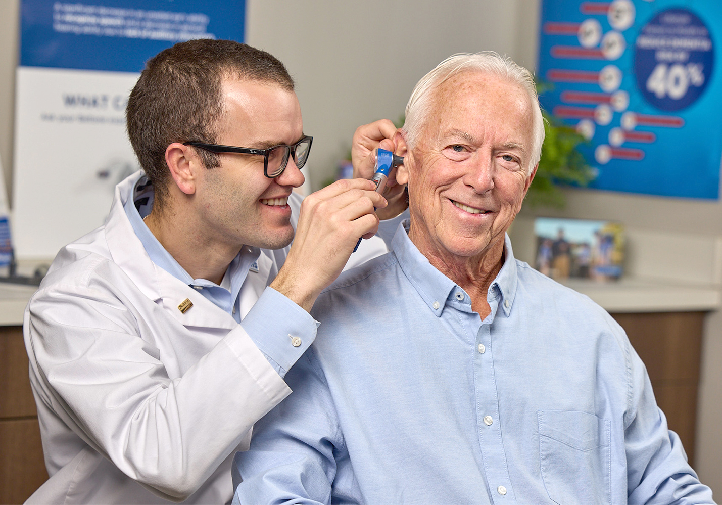 Beltone Hearing Care Practitioner looking in ear canal